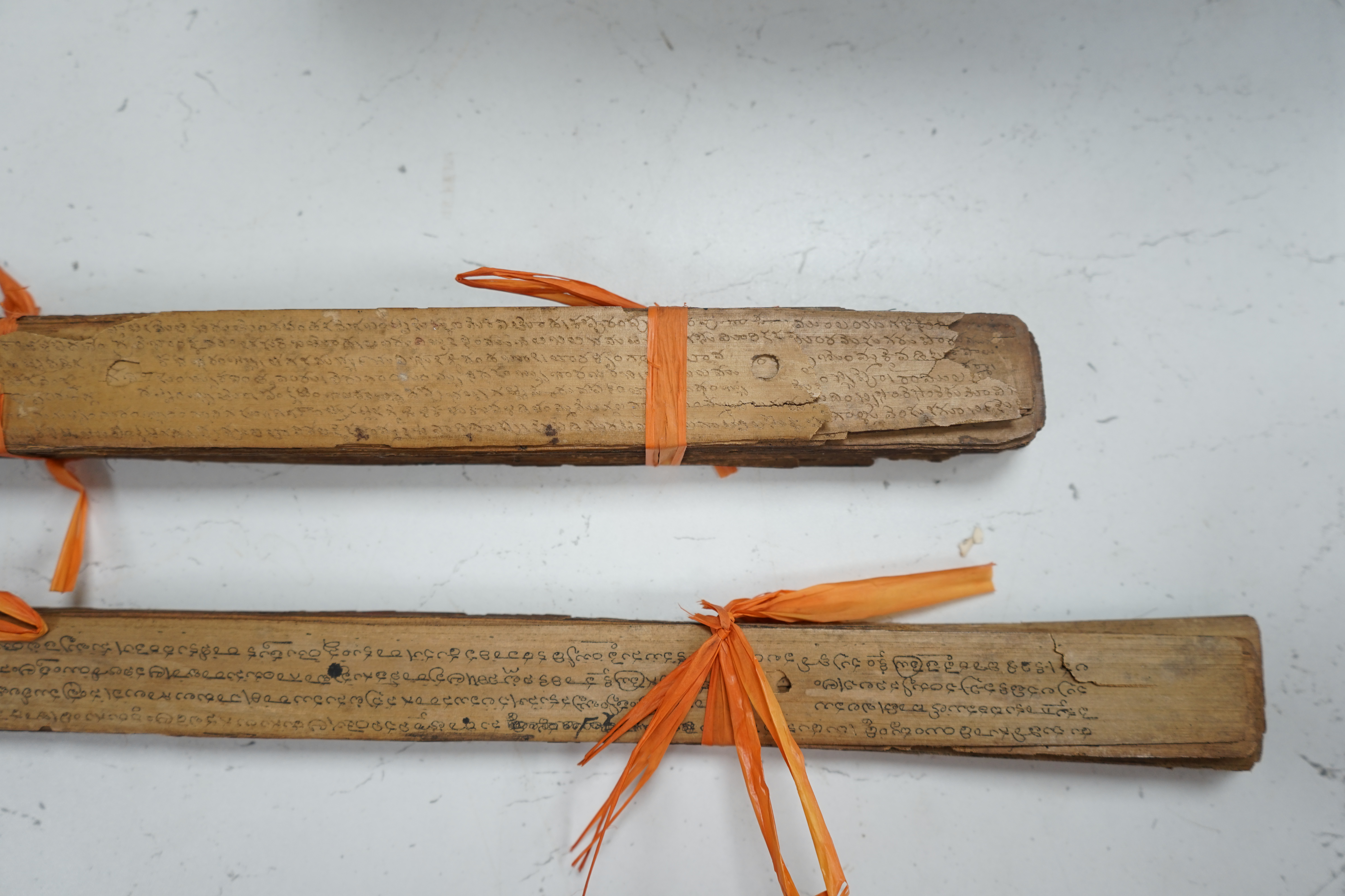 Two Thai or Burmese palm leaf prayer manuscripts. Condition - poor to fair